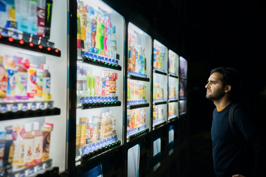 man in front of a vending machine