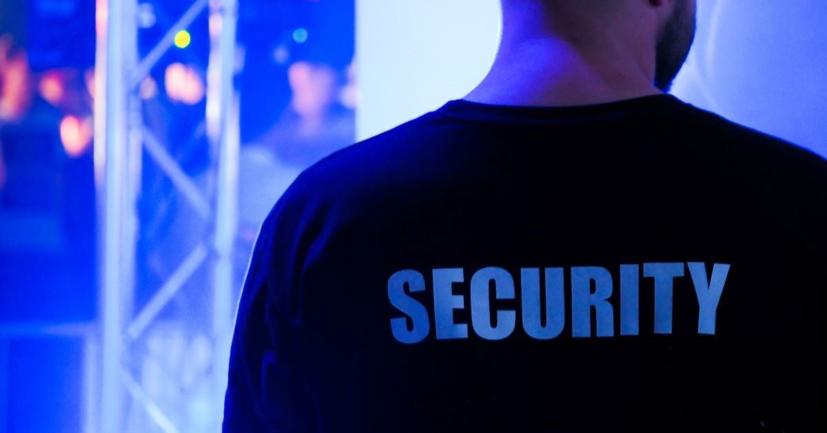 Back of a bouncer's shirt that says "Security"