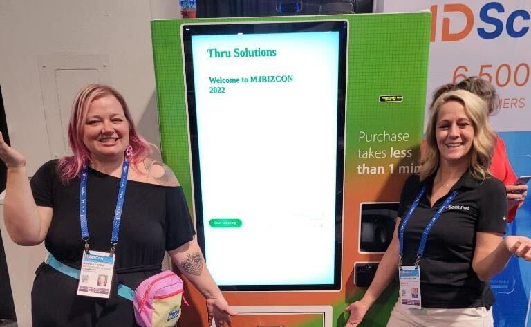 IDScan.net team in front of age restricted vending machine at MJBizCon