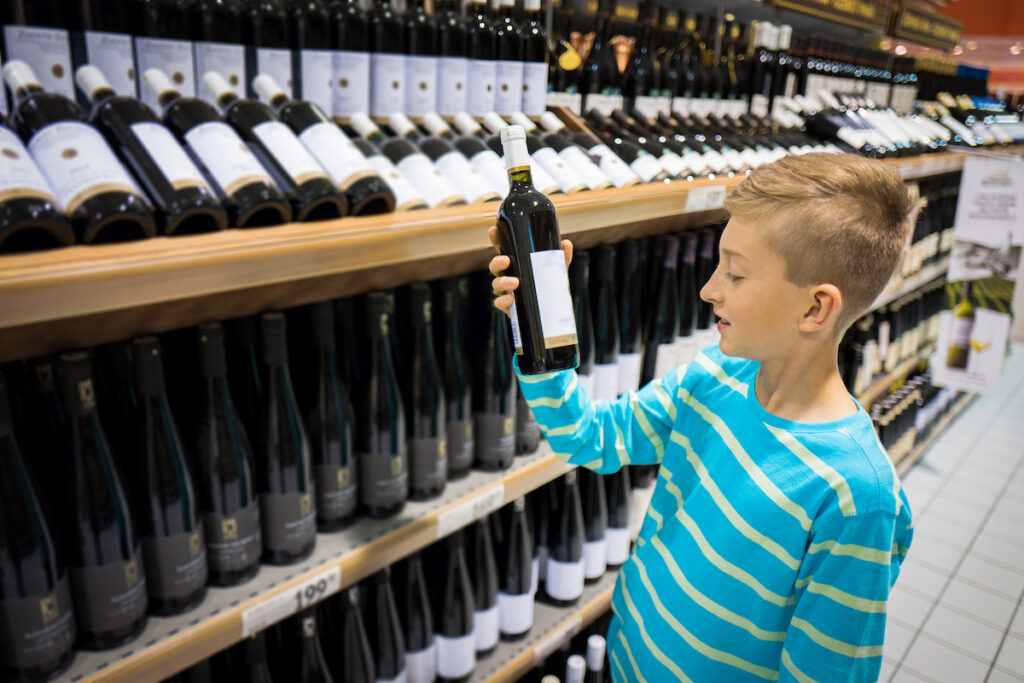 age verification for retailers with a little boy in a wine shop