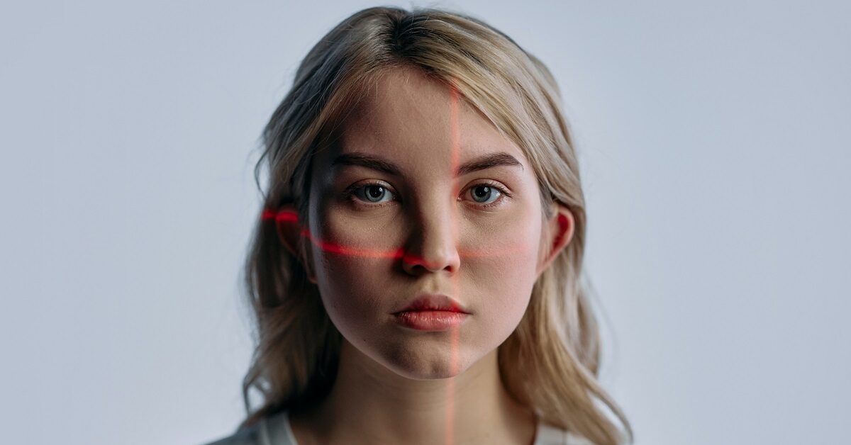 woman having biometric face scan