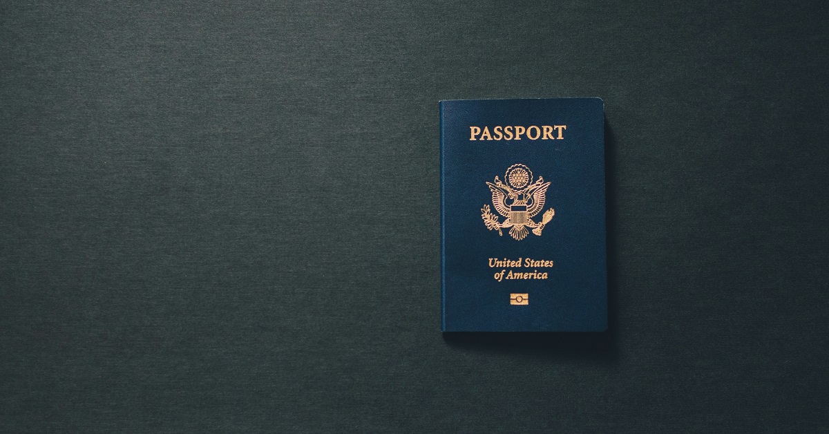 Passport laying on black background