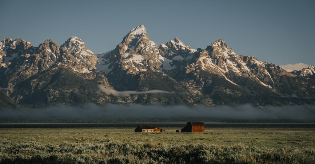 Wyoming cabin set in front of mountain range