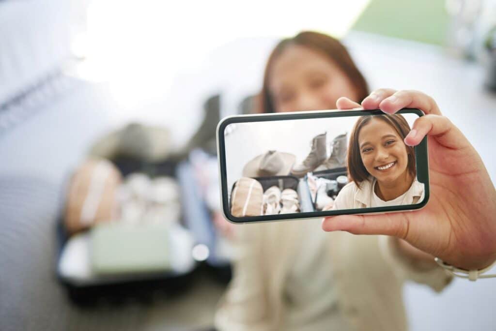 woman holding a video up to the camera