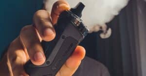 man holding vape