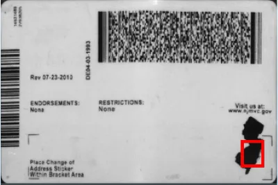 Back of the New Jersey ID showing the black outline of the state