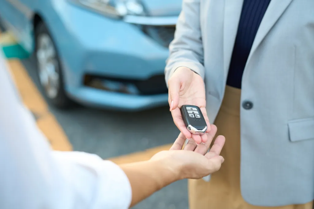 handing over keys for a test drive after identity verification