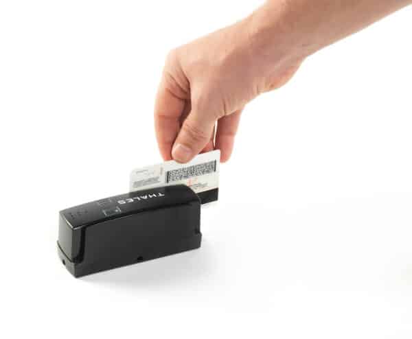 Person swiping ID on a Thales CR100M