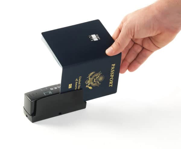 Person scanning a passport on CR100M