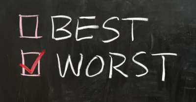 Best and worst written in chalk on a black background with a checkmark next to worst