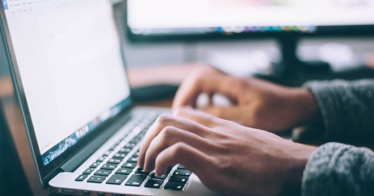 person using laptop computer